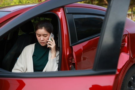 woman on the phone after a car accident