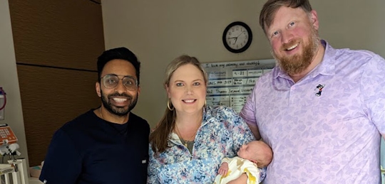 Family and doctor with newborn.